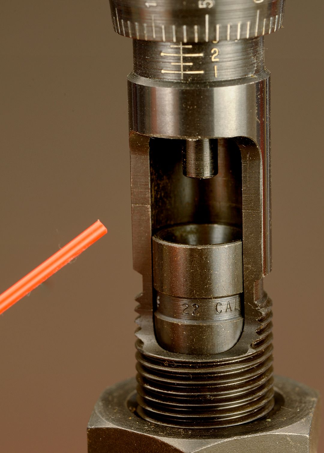 This photo illustrates the movable and free-floating bullet seating system on the die. The bullet sleeve has been moved up for the photo as it usually sits just above the thread line for easy insertion of the bullet.
